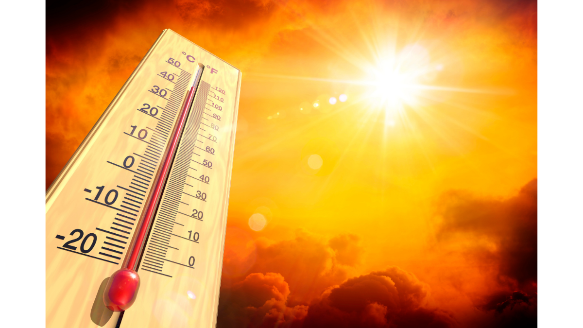 A thermometer against a bright, blazing sun and orange sky, illustrating extreme heat conditions